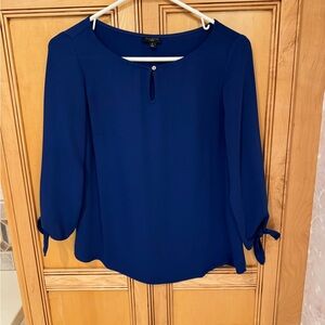Talbots three-quarter sleeve royal blue blouse.